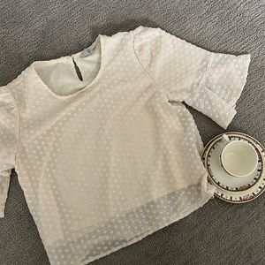 textured cream blouse